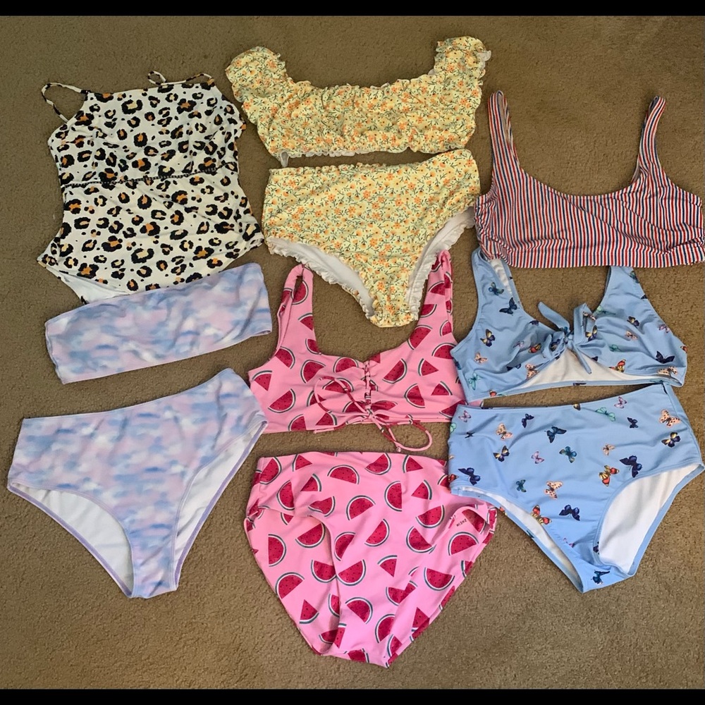 Multi-swim suits, being sold as a lot.